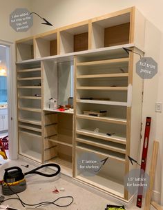 the closet is being built with shelves and tools to work on it's contents