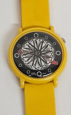 This vintage Swank women's wristwatch is a rare find, with its unique dial adding to its overall appeal. The watch features a two-piece rubber strap in yellow, and an oval-shaped case. The mystery dial is multicolored and displays the time with analog hands.  This watch was manufactured between 1980-1989 and has a casual style that is perfect for everyday wear. It is not water-resistant and has a quartz movement. Its bezel is yellow in color, and the case measures 34mm. This vintage Swank watch is a must-have for any collector or lover of unique timepieces. Bracelet Vintage, Women Wrist Watch, Wrist Watches, Cool Watches, Quartz Movement, Time Piece, Womens Watches, Casual Style, Wrist Watch