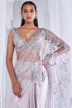 Shop for Dolly J Silver Lycra + Tulle Amoudi Ray Draped Saree Set With Blouse for Women Online at Aza Fashions Elegant Silver Pre-draped Saree With Sequins, Elegant Fitted Silver Blouse Piece, Elegant Silver Pre-draped Saree With Unstitched Blouse, Silver Pre-draped Saree For Party, Silver Pre-draped Festive Saree For Evening, Party Silver Pre-draped Saree, Silver Blouse Piece For Party With Traditional Drape, Silver Traditional Drape Blouse For Party, Fitted Top With Sheer Dupatta For Evening