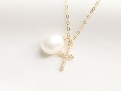 Tiny Cross with Pearl Necklace / Miraculous Necklace / Pearl / Catholic Necklace / Gold Necklace with Cross / Baptism / Gold Filled - Gold Filled 8X15mm Cross Charm - Baroque Pearl - Material: 14k Gold Filled AVAILABLE LENGTH + 16 inches Round Flat Gold Filled + 17 inches Round Flat Gold Filled + 18 inches Round Flat Gold Filled - Pendant and Chain Material: Gold Filled - Water-resistant, tarnish free, hypoallergenic, nickel free and safe for sensitive skin Please note: since our baroque pearls Pearl Drop Cross Necklace Gift, Pearl Drop Cross Pendant Necklace For Gift, Gift Pearl Charm Cross Pendant Necklace, Pearl Charm Cross Necklace For Gift, Cross Necklace With Pearl Charm For Gifts, Cross Necklace With Pearl Charm As Gift, White Crucifix Pearl Necklace As A Gift, White Cross Necklace For Baptism, Handmade Cross Pendant Necklace For Weddings