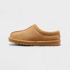 Soft, snug and stylish, these Nola Faux-Suede Clog Slippers from Cat & Jack™ add cozy vibes to your child's shoe collection. Designed in a solid hue, these slippers are made from faux suede with a cushioned footbed and fuzzy lining for all-day comfort. A closed-toe upper with a covered back, slip-on style, and an indoor/outdoor outsole for all-purpose wear complete the design. Cat & Jack™: Designed for all children so you can trust it's made for yours. Construction For Kids, Suede Clogs, Clog Slippers, Moccasins Slippers, Girls Shoes Kids, Children Shoes, Cozy Vibes, Cat & Jack, Shoe Collection