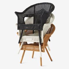 three wicker chairs stacked on top of each other