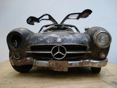 an old mercedes benz sports car is on display