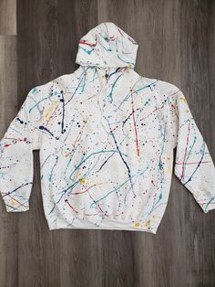 Choose up to 5 colors to make it unique to you and One of a kind. Paint splatter Hoodie, wearable art, from casual and comfortable wearable art collection. Hand painted and embellished. 50% cotton 50% polyester (in inches)        XS  S   M          L         XL        2XL  3XL4XL        5XL Sleeve Length32 ½  33 ½ 34 ½35 ½36 ½37 ½  38 ½39 ½40 ½ Body Width        18  20   22         24        26        28   3032        34 Body Length        26 27   28         29        30        31   32         3 White Cotton Hoodie With Graffiti Print, Artistic Cotton Hooded Hoodie, Artistic Cotton Hoodie, Artistic Cotton Sweatshirt For Winter, Paint On Hoodie, Painting Hoodie, Beige Paint, Clothing Art, Unique Hoodies