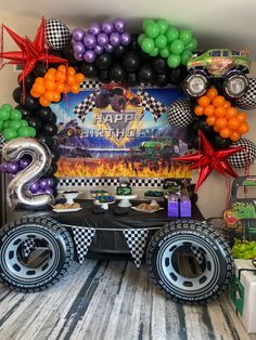 a monster truck themed birthday party with balloons