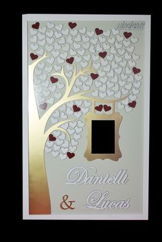 a wedding card with hearts on it and a tree in the middle that says, danielle & lucas