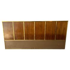 a brown headboard with wooden panels on it