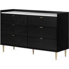 a black dresser with white top and gold legs