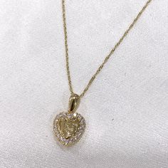 Ioka - Real 14K Gold 15 years old Quinceanera Cubic Zirconia Heart Charm Pendant & 0.9mm Singapore Chain Necklace with Spring Ring Clasp ✅ PENDANT SPECIFICATIONS:  ➤ Height: 0.51 in. (13 MM)  ➤ Width: 0.43 in. (11 MM)  ➤ Average Weight: 0.9 gr. ✅ CHAIN SPECIFICATIONS:  ➤ Width: 0.9 MM  ➤ Clasp Type: Spring Ring  ➤ Made with High Quality Metals  ➤ Strong and Secure to hold Pendant charms.  ➤ Fits Into Bale : 2.5 ✅SHIPPING CONTENTS: -14K Gold Pendant & Chain -Jewelry Box ✅ PREMIUM 14K GOLD:  Our j Gold Heart Necklace Stamped 14k For Wedding, Gold Cubic Zirconia Jewelry In Heart Cut, Gold Cubic Zirconia Heart Cut Jewelry, Gold Heart Cut Cubic Zirconia Jewelry, Gold Heart Cut Birthstone Jewelry, Gold Heart Necklace With Birthstone For Wedding, Heart Cut Cubic Zirconia Gold Jewelry, Gold Heart Cut Necklace With Diamond Accents, Gold Cubic Zirconia Heart Necklace Fine Jewelry