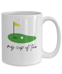 a white coffee mug with the words, my cup of tea on it and a green golf