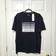 a t - shirt hanging on a door hanger with the words california written across it