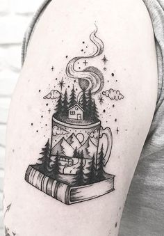 a woman with a tattoo on her arm has a book and a house in it