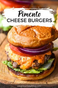 a cheeseburger on a wooden cutting board with the words pinento cheese burgers above it