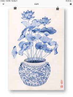 a blue and white vase with flowers in it