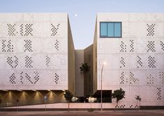 two large white buildings sitting next to each other