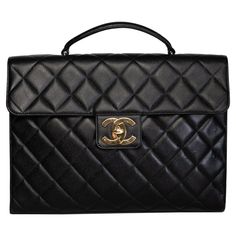 This Chanel briefcase bag is made with black caviar leather with signature diamond quilted stitching. Featuring gold tone hardware, a front flap with the signature interlocking CC turn lock closure, a sturdy top handle, a back full length slip pocket and an interior lined in beige leather with both zip and slip pockets. Perfect work bag for holding a laptop or documents. Chanel bags with the serial number 2XXXXXX are manufactured from 1991 to 1994.. COLOR: BLACK ITEM CODE: 286645 MATERIAL: CAVIA Briefcase Bag, Chanel Accessories, Black Caviar, Chanel Vintage, Quilt Stitching, Leather Briefcase, Work Bag, Diamond Quilt, Michael Kors Hamilton