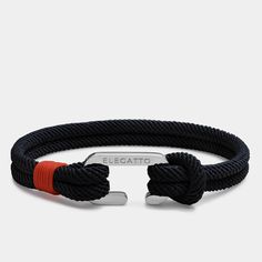 "Minimalist Nautical Rope Bracelet - Black Nylon C-Clasp Bracelet - Elegatto Alchor Jewelry For Men - Perfect Gifts for him 2022 The Alchor bracelet uses mixed materials to striking effect with a black nautical nylon cord, a nylon string of vivid red color and Elegatto's classic silver-plated C-Clasp shackle. These two strands are intertwined with hardware in a polished finish that offers a classic twist to the nautical design. The polished shackle shapes a secure closure. Simple enough to wear Gifts For Him 2022, Unique Husband Gifts, Nautical Bracelet, Rope Jewelry, Nautical Rope, Great Gifts For Dad, Simple Reminders, Summer Bracelets, Jewelry For Men