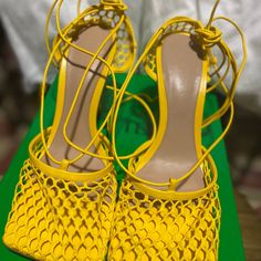 Bottega Veneta - Yolk Heels! Comes W/Dust Bag Only! Lightly Worn. In Amazing Condition. Bottega Veneta Net Fabric And Leather Pumps. 3.5" Stiletto Heel. Square Toe. Adjustable Ankle Ties. Smooth Sole. Made In Italy. Designer Lace-up Sandals For Summer, Yellow Lace-up Heels For Summer, Designer Lace-up Sandals For Summer Party, Luxury Lace-up Sandals For Spring, Luxury Yellow Heels For Summer, Luxury Yellow Summer Heels, Designer Yellow Summer Heels, Designer Yellow Heels For Summer, Luxury Lace-up Summer Sandals