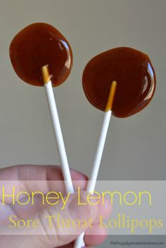 there are two lollipops with peanut butter on them, and one is dipped in caramel