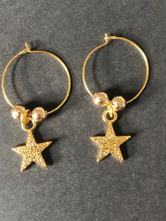 Handmade gold star hoop earrings  ⭐️ Gold plated hoop earrings with gold plated star charms & beads ⭐️ Lightweight & easy to wear Purchasing as a gift? Upgrade to a gift box: https://etsy.me/3gDqVD1 Celestial Gold Dangle Hoop Earrings, Gold Star-shaped Celestial Hoop Earrings, Gold Celestial Star Hoop Earrings, Gold Star-shaped Earrings With Ear Wire, Gold-plated Hoop Earrings With Star Charm, Gold Plated Star-shaped Hoop Earrings, Gold Plated Star Shaped Hoop Earrings, Gold Star Earrings With Ear Wire, Celestial Gold Star Hoop Earrings