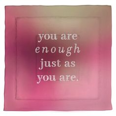 the words you are enough just as you are written in white on a pink background