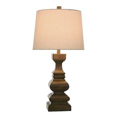 a wooden lamp with a white shade on it