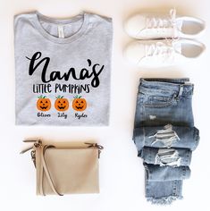 "Get that special someone in your life a fun personalized Halloween/Fall t-shirt! Can customize \"Nana\" as well as amount of pumpkins and names below! Fill out in personalization tab -----ABOUT OUR TEES----- Our tees fit like a well-loved favorite, featuring a crew neck, short sleeves and designed with superior Airlume combed and ring-spun cotton that acts as the best blank canvas for printing. Key Features: - Heat transfer vinyl print - Retail fit - Side seamed - Shoulder taping - Fitted at bi Casual Personalized T-shirt For Fall, Personalized Casual T-shirt For Fall, Personalized Tops As Fall Gifts, Cadeau Grand Parents, Nana Grandma, Personalized Grandma Gifts, Fall T Shirt, Grands Parents, Cute Shirt Designs