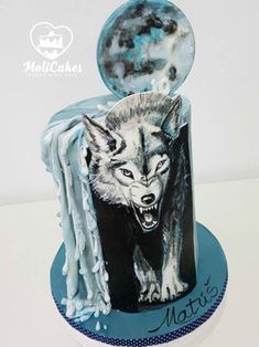 a birthday cake decorated with an image of a wolf