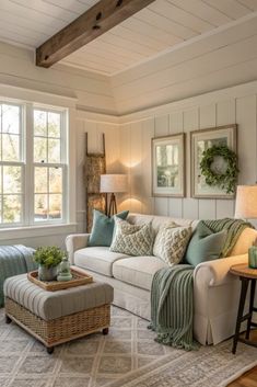 a living room filled with furniture and decor on top of a wooden floor next to a window