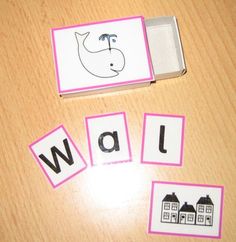 the word wall is cut out and placed in front of two matching cards on a table