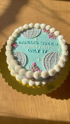 a cake sitting on top of a wooden table