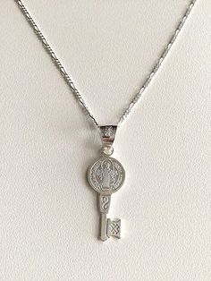 "925 STERLING SILVER SAINT BENEDICT KEY NECKLACE 20\" LONG... FOR GOOD LUCK ,PROSPERITY AND PROTECTION. MADE IN ITALY-BEST QUALITY PENDANT : 32x11mm CADENA DE SAN BENITO EN 925 PLATA ESTERLINA 20\" LARGO .. PARA PROSPERIDAD, BUENA SUERTE Y PROTECCION. HECHO EN ITALIA-MEJOR CALIDAD DIJE: 32x11mm" Personalized Silver Jewelry For Good Luck, Silver Key Pendant Necklace, Silver Necklace With Two Keys For Gift, Silver Pendant Necklace With Two Keys, Good Luck Silver Engraved Charm Necklaces, Silver Engraved Charm Necklace For Good Luck, Good Luck Silver Engraved Charm Necklace, Personalized Silver Necklace For Good Luck, Good Luck Engraved Silver Charm Necklace