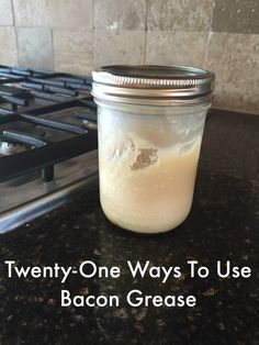 a mason jar filled with liquid sitting on top of a counter next to a stove