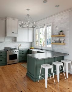 a kitchen with white cabinets and green island