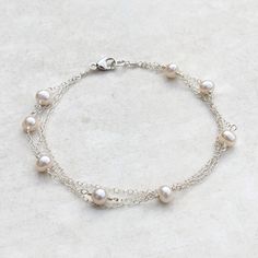 Our Ivy bracelet is made using several gorgeous freshwater near round pearls and three layers of high quality sterling silver trace chain. She moves so beautifully and looks stunning on the wrist. The Ivy makes an ideal gift that everyone will love to wear! Available in multiple sizes and also available in 12k gold filled.  All Kiri & Belle pieces are carefully handmade in the UK using the highest quality materials. Celebrating the unique and organic beauty of baroque pearls. A free Kiri & Belle Ivy Bracelet, Unique Jewelry Vintage, Feminine Vibes, Jewels Diy, Pretty Jewelry Necklaces, Layered Chain, The Ivy, Layered Chains, Handmade Wire Jewelry