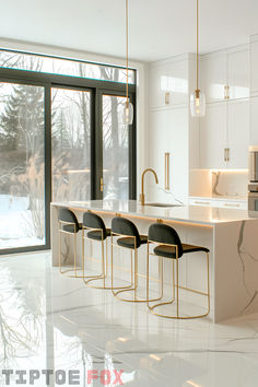 a kitchen with marble counter tops and bar stools in front of an open window