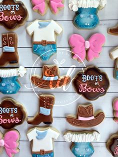 decorated cookies are arranged in the shape of cowboy boots, booties and hats for baby shower