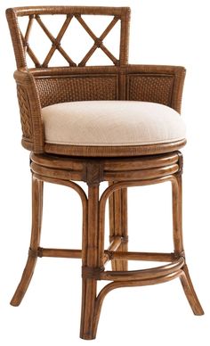 a wicker bar stool with a cushion on the seat and backrests, in front of a white background