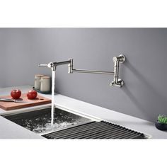 a kitchen sink with a faucet and cutting board