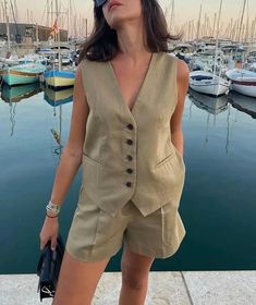 Elevate your summer style with our linen short set vest. Crafted from breathable linen fabric, this chic ensemble seamlessly combines comfort and sophistication. The versatile set features tailored shorts and a matching vest, perfect for a casual day out or a stylish evening affair. Embrace laid-back elegance with this must-have addition to your wardrobe. 🖤 DETAILS - Front button  - High waisted  - Invisible zip closure at font 🖤 SIZE XS Bust:  33.5" / 84cm Waist: 26" / 68cm Hips: 36" / 91cm S Spring Linen Beach Vest, Summer Beach Linen Vest, V-neck Linen Vest For Summer, V-neck Linen Summer Vest, Chic Summer Linen Vest, Beige Summer Sets With Pockets, Summer Beige Sets With Pockets, Summer Linen Vest With Pockets, Spring Linen Vest For Day Out