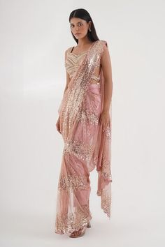 Pink pre-draped pant saree with sequin cluster embellished base and bead tassels. Comes with nalki embroidered padded blouse embellished by beads and stones. - Aza Fashions Glamorous Draped Sets With Sequins, Glamorous Draped Sequin Sets, Glamorous Draped Festive Choli, Glamorous Festive Draped Choli, Festive Embellished Fitted Pre-draped Saree, Fitted Pre-draped Saree With Sequins For Diwali, Fitted Pre-draped Sequin Saree For Festivals, Festive Draped Sharara With Mirror Work, Traditional Draped Choli With Sequins