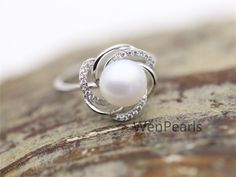 "This pearl ring is made of 9mm AAA genuine freshwater round pearls, setting with sterling silver and crystal mount, size is adjustable, it is a open ring. Gift for wedding, birthday, friend,anniversary gifts. ~Jewelry: Genuine Pearl Ring,S925 Sterling Silver Ring ~Natural Freshwater pearls ~Pearl Luster: High,good ~Pearl skin: clean ~Pearl Shape: Button Round ~Pearl Color: white ~Pearl Size: 10mm ~Pearl quality: AAA ~Metal: sterling silver with rhinestone,NICKLE FREE, ~Ring size: suitable finge Round Pearl Promise Ring With Prong Setting, Cubic Zirconia Pearl Ring With Prong Setting For Promise, Diamond White Round Pearl Promise Ring, Diamond White Pearl Promise Ring, Gift Pearl Ring With Cubic Zirconia In Prong Setting, Anniversary Pearl Ring With Prong Setting And Cubic Zirconia, Pearl White Promise Ring, Silver Pearl Ring With Prong Setting, Sterling Silver Pearl Ring For Wedding, Fine Jewelry