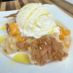 a white plate topped with dessert and ice cream