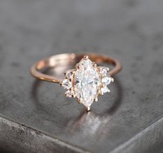 a diamond ring sitting on top of a table