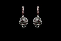 "Silver skull earrings \" Flover Frida\" Metal - Sterling Silver 925 Gemstones - cubic zirconia Weight - 10 grams. We need 2 weeks to make a earrings with various changes such as: -other size (Custom order only) -other jewelry stones -and so on Please check all my ring's catalog to choose your favorite https://www.etsy.com/shop/YetiBikersJewelry All of our items have been designed and produced by ourselves All your feedback is very important for us. Please don't forget to leave us a positive fee Gothic Silver Jewelry With Skull Print, Gothic Sterling Silver Jewelry With Skull Print, Silver Skull Earrings With Skull Print, Gothic Sterling Silver Skull Earrings, Nickel-free Sterling Silver Skull Jewelry, Gothic Skull Pierced Jewelry, Silver Skull Shaped Single Earring, Mens Silver Pendants, Skull Earring