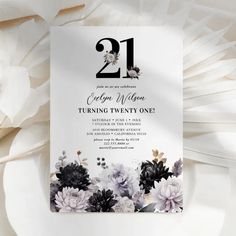 a white and black floral 21st birthday party card with the number 21 on it's front