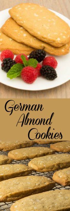 german almond cookies with raspberries and mint leaves on a plate next to them