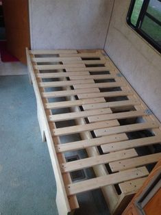 the bed frame is made up and ready to be used as a headboard for an rv