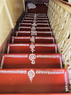 some red and white stairs with designs on them