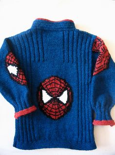 a blue sweater with spiderman eyes on it